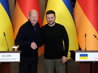 In Kyiv, Ukraine, on December 2, 2024, President of Ukraine Volodymyr Zelenskyy shakes hands with Federal Chancellor of Germany Olaf Scholz...