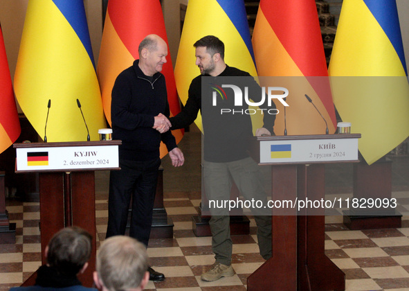 In Kyiv, Ukraine, on December 2, 2024, President of Ukraine Volodymyr Zelenskyy shakes hands with Federal Chancellor of Germany Olaf Scholz...