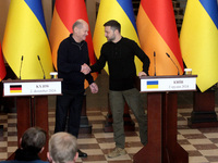 In Kyiv, Ukraine, on December 2, 2024, President of Ukraine Volodymyr Zelenskyy shakes hands with Federal Chancellor of Germany Olaf Scholz...