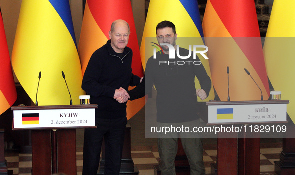 In Kyiv, Ukraine, on December 2, 2024, President of Ukraine Volodymyr Zelenskyy shakes hands with Federal Chancellor of Germany Olaf Scholz...