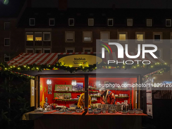 In Nuremberg, Bavaria, Germany, on December 1, 2024, the Palestine stand displays ceramic items from Nablus at the adjacent market of the Nu...