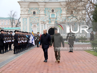 In Kyiv, Ukraine, on December 2, 2024, Federal Chancellor of Germany Olaf Scholz and President of Ukraine Volodymyr Zelenskyy (L to R) walk...