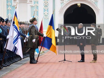 Federal Chancellor of Germany Olaf Scholz and President of Ukraine Volodymyr Zelenskyy face honor guards at Saint Sophia Cathedral in Kyiv,...