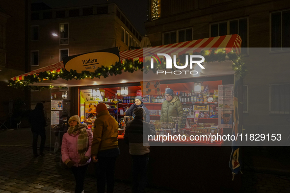 Israel stands with different items at the adjacent market of the Nuremberg Christmas Market in Nuremberg, Bavaria, Germany, on December 1, 2...