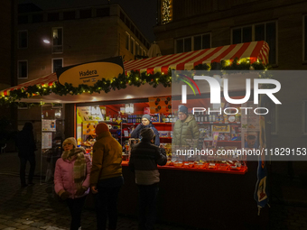 Israel stands with different items at the adjacent market of the Nuremberg Christmas Market in Nuremberg, Bavaria, Germany, on December 1, 2...