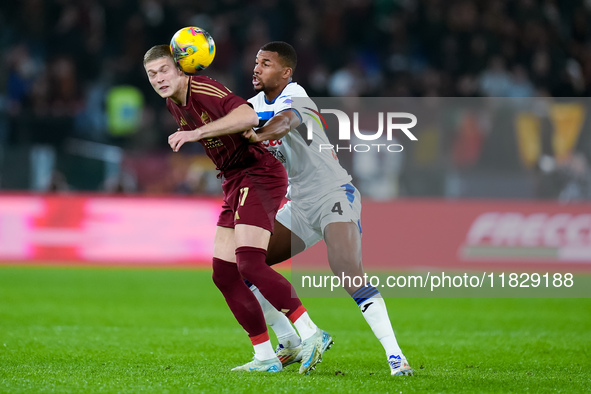 Isak Hien of Atalanta BC and Artem Dovbyk of AS Roma compete for the ball during the Serie A Enilive match between AS Roma and Atalanta BC a...