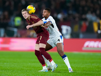 Isak Hien of Atalanta BC and Artem Dovbyk of AS Roma compete for the ball during the Serie A Enilive match between AS Roma and Atalanta BC a...