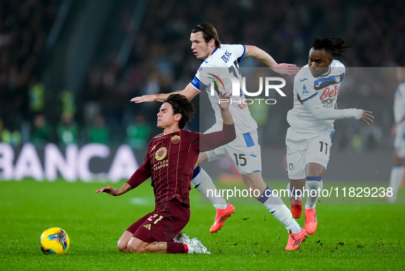 Paulo Dybala of AS Roma and Marten de Roon of Atalanta BC compete for the ball during the Serie A Enilive match between AS Roma and Atalanta...