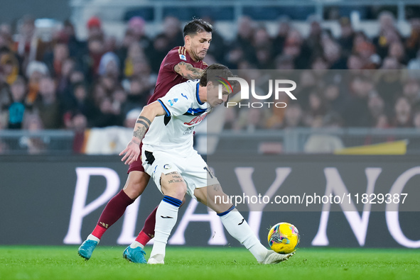 Nicolo Zaniolo of Atalanta BC and Leandro Paredes of AS Roma compete for the ball during the Serie A Enilive match between AS Roma and Atala...