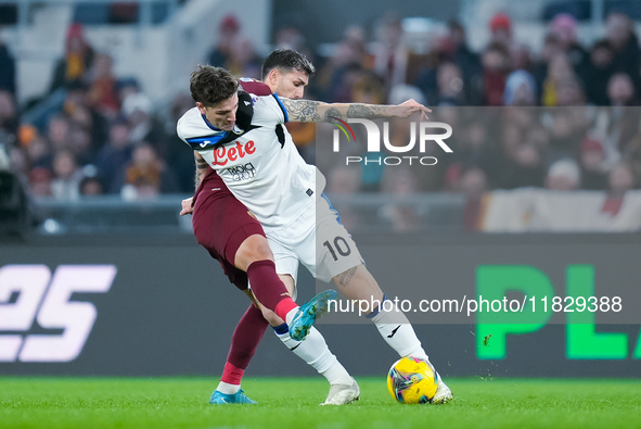 Nicolo Zaniolo of Atalanta BC and Leandro Paredes of AS Roma compete for the ball during the Serie A Enilive match between AS Roma and Atala...