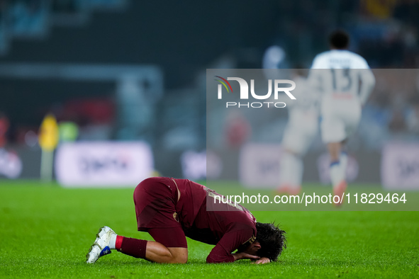 Paulo Dybala of AS Roma lies injured on the ground during the Serie A Enilive match between AS Roma and Atalanta BC at Stadio Olimpico on De...