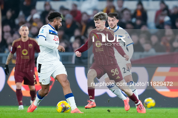 Alexis Saelemaekers of AS Roma and Ederson of Atalanta BC compete for the ball during the Serie A Enilive match between AS Roma and Atalanta...