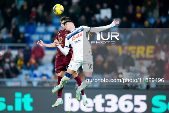 Stephan El Shaarawy of AS Roma and Raoul Bellanova of Atalanta BC jump for the ball during the Serie A Enilive match between AS Roma and Ata...