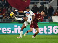 Isak Hien of Atalanta B.C. and Eldor Shomurodov of A.S. Roma are in action during the 14th day of the Serie A Championship between A.S. Roma...