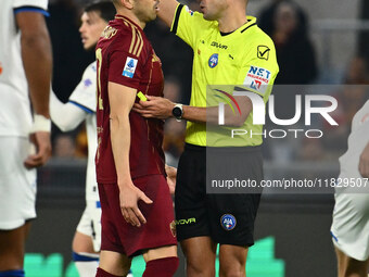 Stephan El Shaarawy of A.S. Roma and referee Marco Guida are present during the 14th day of the Serie A Championship between A.S. Roma and A...