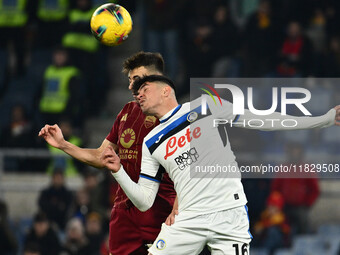 Stephan El Shaarawy of A.S. Roma and Raoul Bellanova of Atalanta B.C. are in action during the 14th day of the Serie A Championship between...