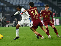 Juan Cuadrado of Atalanta B.C. and Eldor Shomurodov of A.S. Roma are in action during the 14th day of the Serie A Championship between A.S....