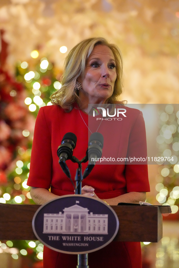 First Lady Dr. Jill Biden greets volunteers who help decorate the White House Christmas displays. Earlier in the day, she is asked if she su...