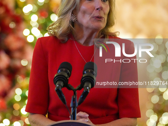 First Lady Dr. Jill Biden greets volunteers who help decorate the White House Christmas displays. Earlier in the day, she is asked if she su...