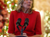 First Lady Dr. Jill Biden greets volunteers who help decorate the White House Christmas displays. Earlier in the day, she is asked if she su...