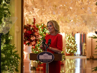 First Lady Dr. Jill Biden greets volunteers who help decorate the White House Christmas displays. Earlier in the day, she is asked if she su...