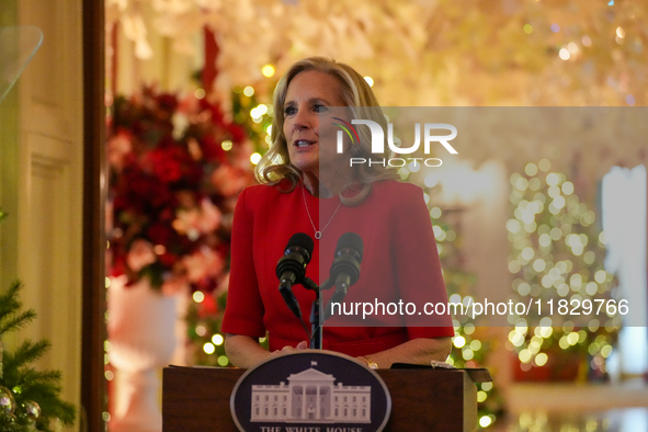 First Lady Dr. Jill Biden greets volunteers who help decorate the White House Christmas displays. Earlier in the day, she is asked if she su...