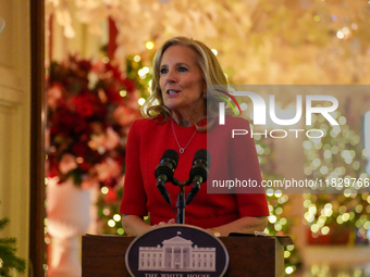 First Lady Dr. Jill Biden greets volunteers who help decorate the White House Christmas displays. Earlier in the day, she is asked if she su...