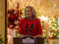 First Lady Dr. Jill Biden greets volunteers who help decorate the White House Christmas displays. Earlier in the day, she is asked if she su...