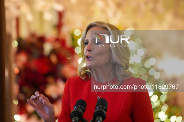 First Lady Dr. Jill Biden greets volunteers who help decorate the White House Christmas displays. Earlier in the day, she is asked if she su...