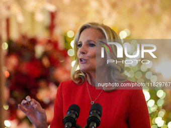 First Lady Dr. Jill Biden greets volunteers who help decorate the White House Christmas displays. Earlier in the day, she is asked if she su...