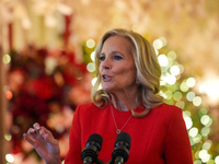 First Lady Dr. Jill Biden greets volunteers who help decorate the White House Christmas displays. Earlier in the day, she is asked if she su...