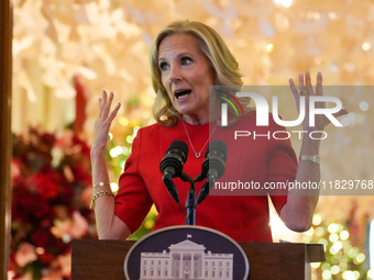 First Lady Dr. Jill Biden greets volunteers who help decorate the White House Christmas displays. Earlier in the day, she is asked if she su...