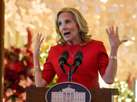 First Lady Dr. Jill Biden greets volunteers who help decorate the White House Christmas displays. Earlier in the day, she is asked if she su...