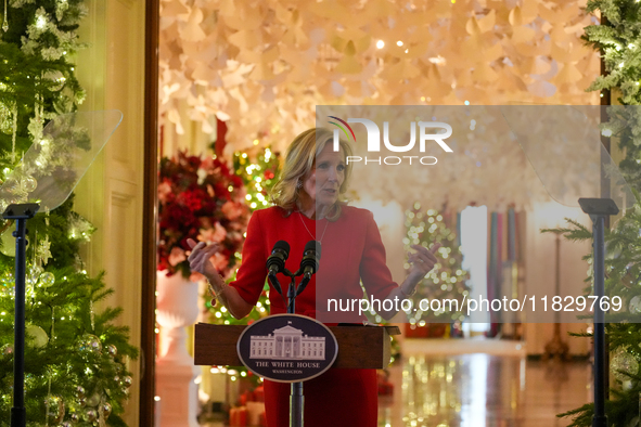 First Lady Dr. Jill Biden greets volunteers who help decorate the White House Christmas displays. Earlier in the day, she is asked if she su...