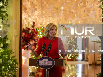 First Lady Dr. Jill Biden greets volunteers who help decorate the White House Christmas displays. Earlier in the day, she is asked if she su...