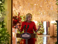 First Lady Dr. Jill Biden greets volunteers who help decorate the White House Christmas displays. Earlier in the day, she is asked if she su...