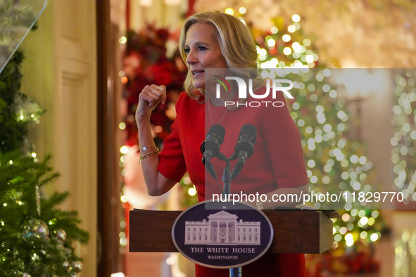 First Lady Dr. Jill Biden greets volunteers who help decorate the White House Christmas displays. Earlier in the day, she is asked if she su...