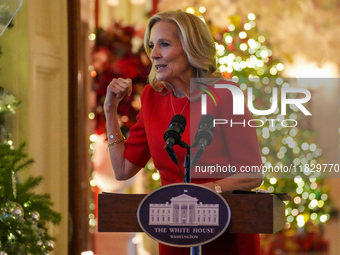 First Lady Dr. Jill Biden greets volunteers who help decorate the White House Christmas displays. Earlier in the day, she is asked if she su...