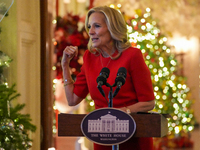 First Lady Dr. Jill Biden greets volunteers who help decorate the White House Christmas displays. Earlier in the day, she is asked if she su...