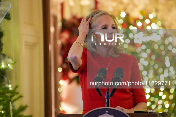 First Lady Dr. Jill Biden greets volunteers who help decorate the White House Christmas displays. Earlier in the day, she is asked if she su...