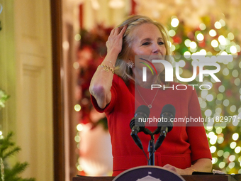 First Lady Dr. Jill Biden greets volunteers who help decorate the White House Christmas displays. Earlier in the day, she is asked if she su...