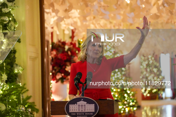 First Lady Dr. Jill Biden greets volunteers who help decorate the White House Christmas displays. Earlier in the day, she is asked if she su...