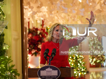 First Lady Dr. Jill Biden greets volunteers who help decorate the White House Christmas displays. Earlier in the day, she is asked if she su...