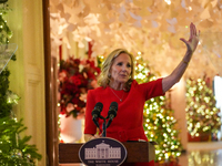 First Lady Dr. Jill Biden greets volunteers who help decorate the White House Christmas displays. Earlier in the day, she is asked if she su...