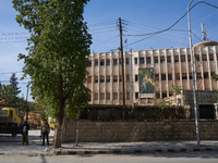 A Syrian opposition fighter stands guard at a government building in Aleppo, Syria, on December 1, 2024 (