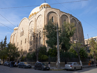 Residents walk near a church in Aleppo, Syria, after the armed opposition takes control of the city, on December 1, 2024.  (