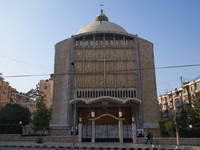 Residents walk near a church in Aleppo, Syria, after the armed opposition takes control of the city, on December 1, 2024.  (