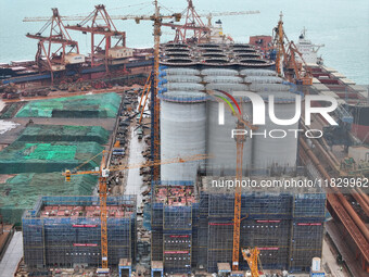 A photo taken on December 3, 2024, shows the construction site of the first phase of the project at Lianyungang International Grain Distribu...