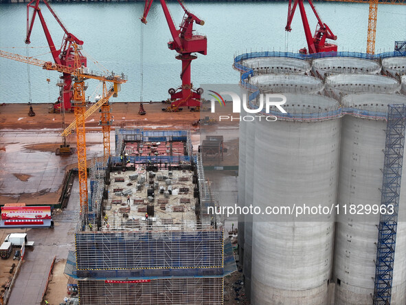 A photo taken on December 3, 2024, shows the construction site of the first phase of the project at Lianyungang International Grain Distribu...