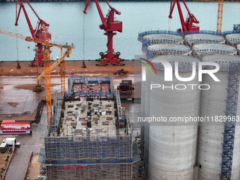 A photo taken on December 3, 2024, shows the construction site of the first phase of the project at Lianyungang International Grain Distribu...